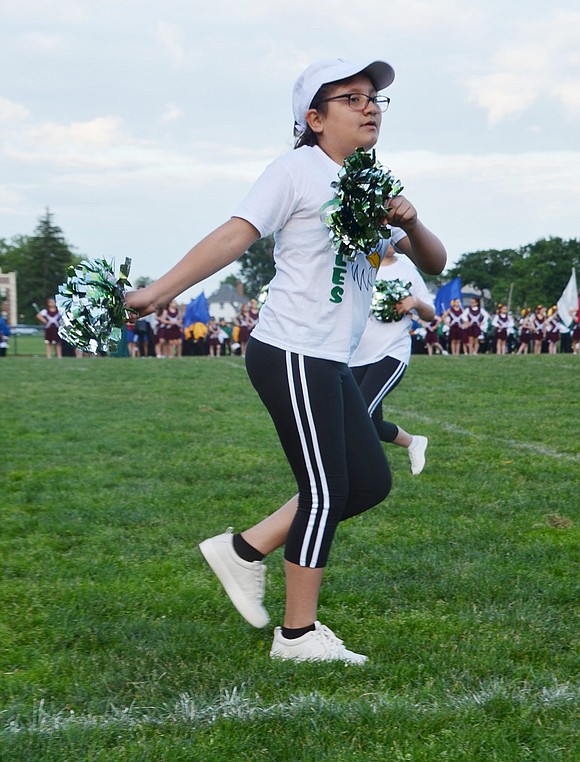 Edison Elementary School fifth-grader Joscelyn Lopez shows style on the field as she pulls off her routine.   