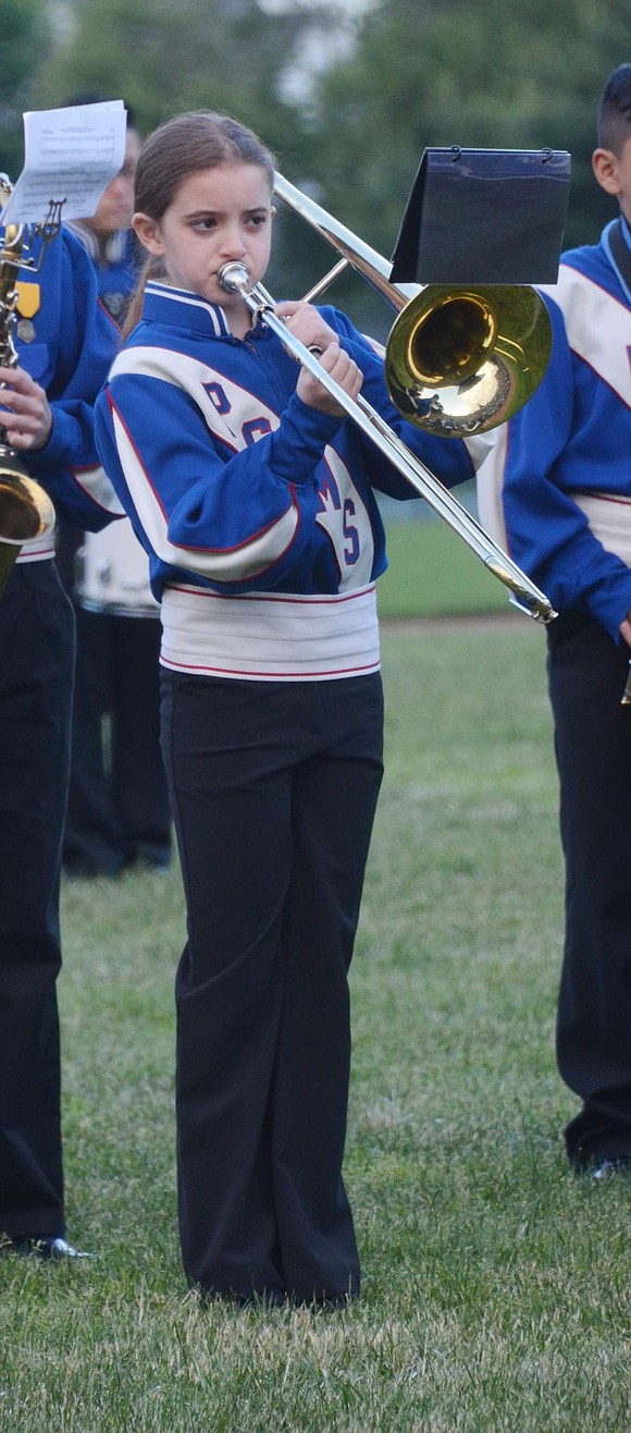 Port Chester Middle School sixth-grader Allegra Burke plays her trombone with pristine posture.