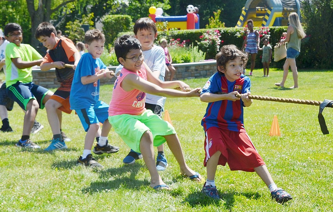 Park Avenue Elementary School second-graders Lucas Arguello (front) and Oscar Morales lead the line in a boys versus girls tug o’ war match. Despite their efforts, in this one the girls were victorious. 