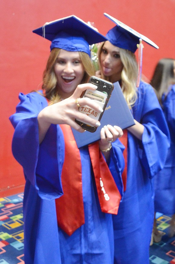 Now that Carly Hecht (left) and Gabrielle Feuerstein have finally graduated, first things first: time for a selfie.