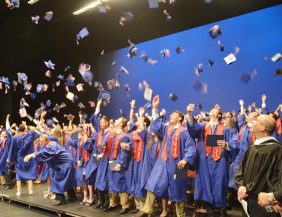 Seconds after their graduation from high school becomes official, members of the Blind Brook class of 2018 whip their caps into the air.