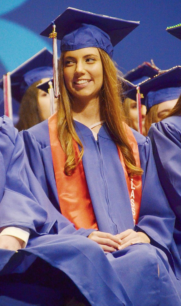 Julia Sunshine eagerly waits for her row to be called to receive their diplomas. 