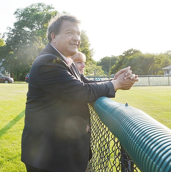 Taking a break from the ice cream, Westchester County Executive George Latimer and his wife Robin watch the Rye Brook Rebels vs. the Harrison Huskies game at the baseball field at Pine Ridge Park.