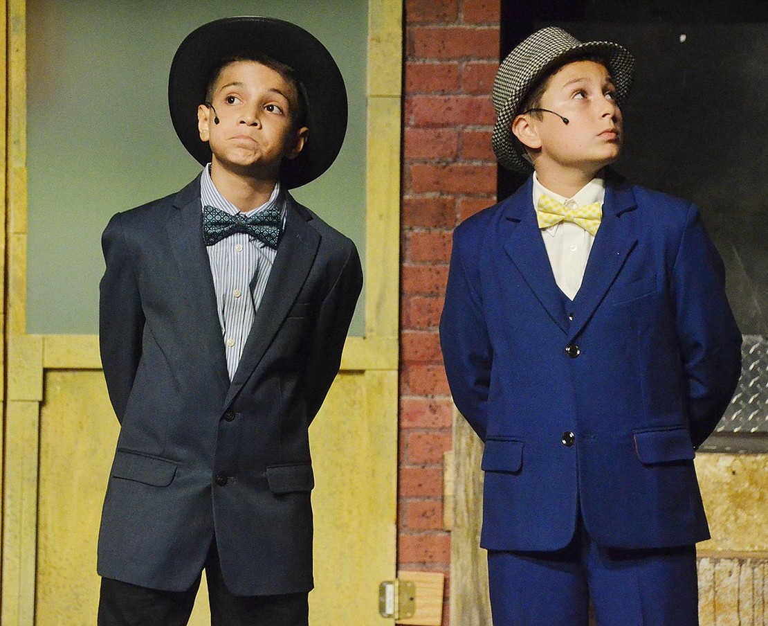 While their friend Nathan Detroit gets hounded by Lt. Brannigan, Nicely-Nicely Johnson (left), played by Vincent Sculti, and Benny Southstreet, played by Julian Lopez, try to act inconspicuous.  Sarah Wolpoff|Westmore News 