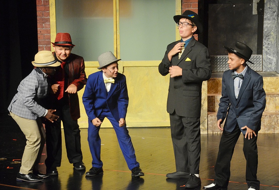 The gang of gamblers praise Nathan Detroit, played by Sean Mealey, while singing “The Oldest Established.” Sarah Wolpoff|Westmore News 