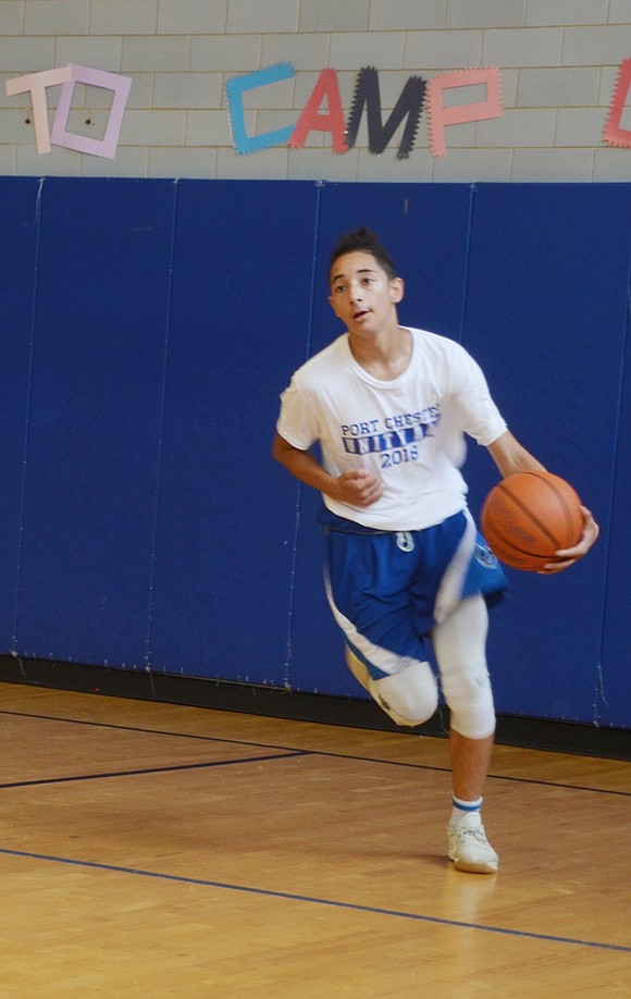 Soon to be Port Chester High School junior Josue Gonzalez bolts down the Carver Center basketball court with the ball. 