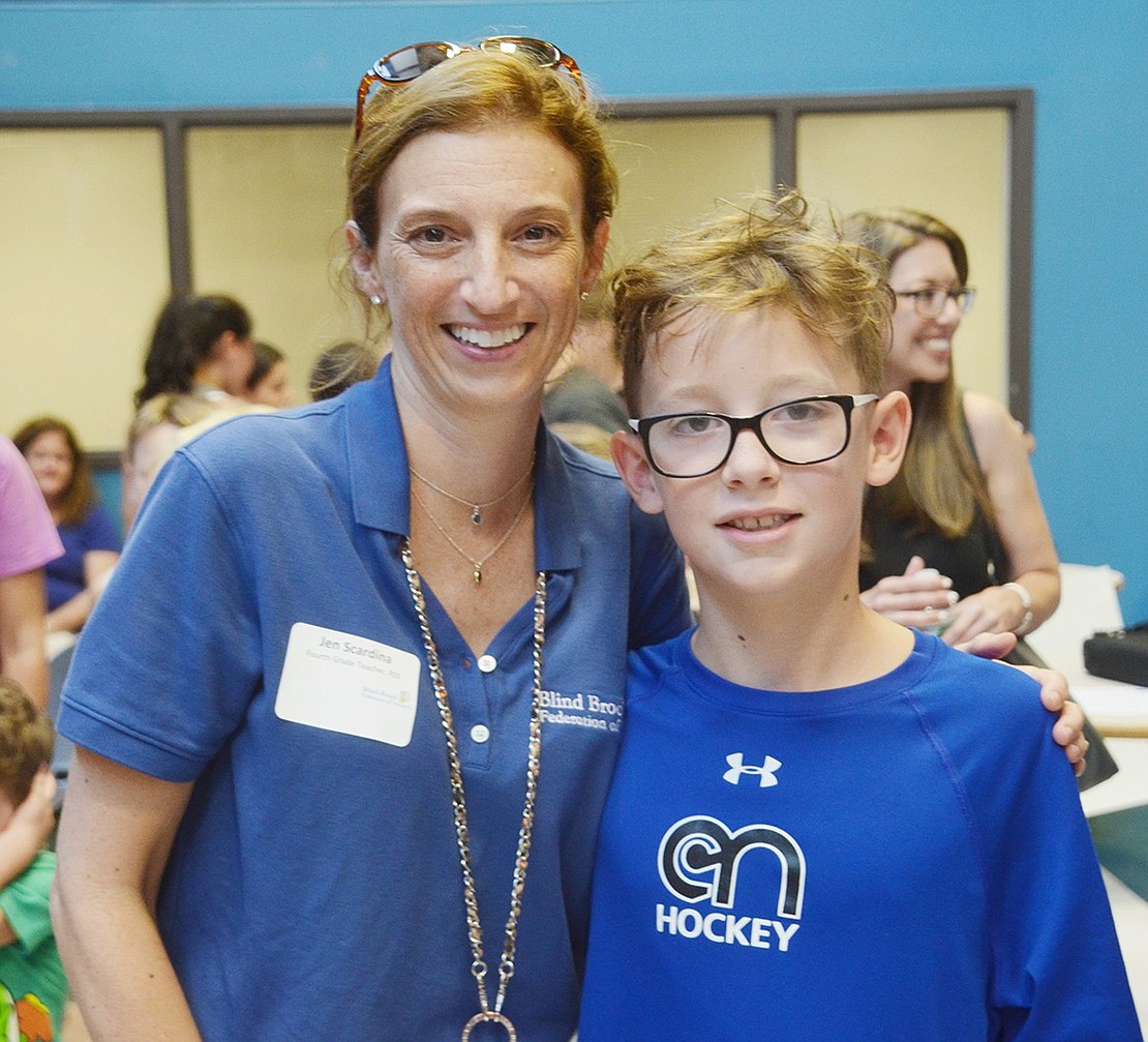 Rising fourth-grader Jack Scala introduces himself to his new teacher Jen Scardina. Scala is excited because he has lots of friends in the same class this year and Scardina is excited about all the energy that’s sure to bring.