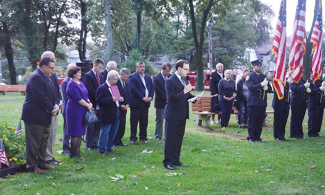 Surrounded by local politicians and volunteer firefighters posting the colors, Rabbi Ben Goldberg of Congregation Kneses Tifereth Israel gives the invocation during the 9/11 Remembrance Ceremony at Lyon Park recognizing the 17th anniversary of the September 11 terrorist attacks.