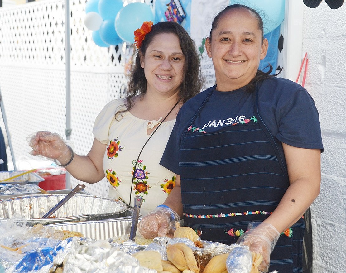 The International Food Day festival celebrates the harmonization of different cultures by featuring free Latin food from various countries representative of the congregation. Merritt Street resident Delny Icquierdo (right) and her friend Glenda Duarte of Greenwich, Conn., serve up homemade Guatemalan specialties.