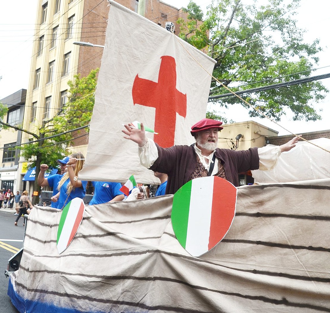 Cameoing as Christopher Columbus, Port Chester Italian Heritage Club member Stephen Tofano rides on the group’s new parade float while waving to spectators and welcoming them in Italian.