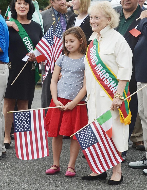 Grand Marshal Anne Capeci prepares to lead the parade with her 8-year-old granddaughter Annie Mikolasko.