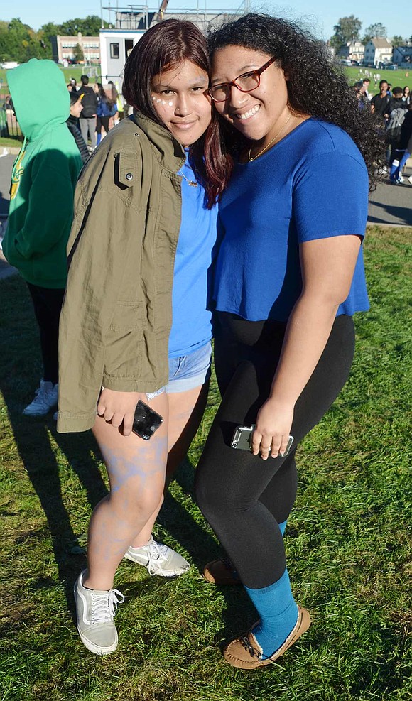 While enjoying the carnival with the 3,000 other attendees, Kaitlyn Mestas (left) and Angela Espinal take a moment to pose for a photo. The sophomores made sure to wear blue to show school spirit.