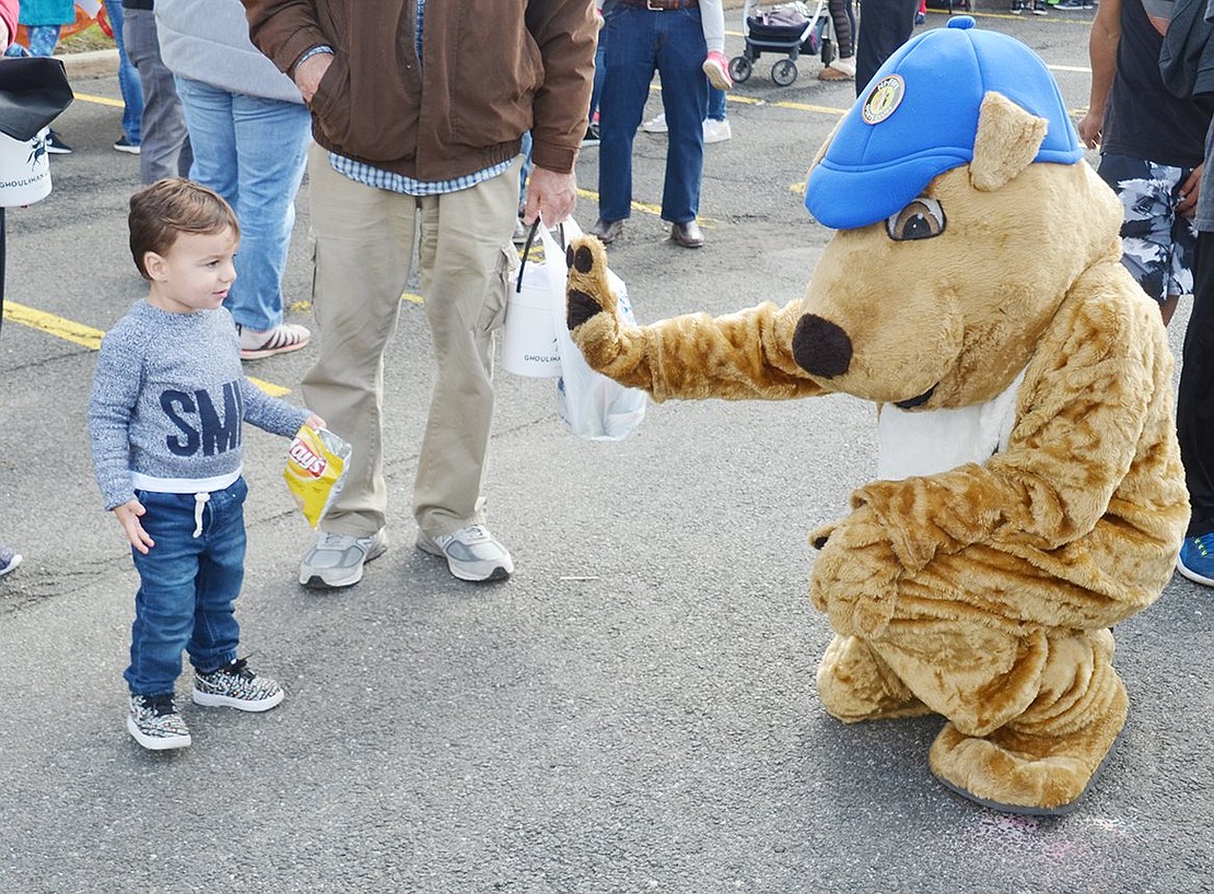 Feeling extremely skeptical of the Hi-Five Sports mascot walking around, Wesley Honig decides to decline its request for a high-five. The Legendary Circle resident will be celebrating his second birthday next month.