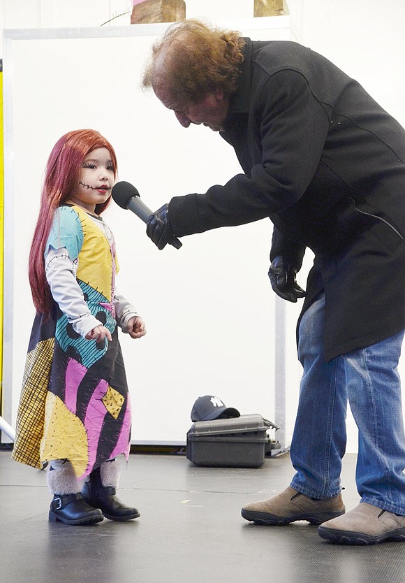 While interviewing contestants, Ang Rubino asks shy Spring Street resident Alianna More, a King Street Elementary School kindergartener, about her Sally costume from “The Nightmare Before Christmas.”