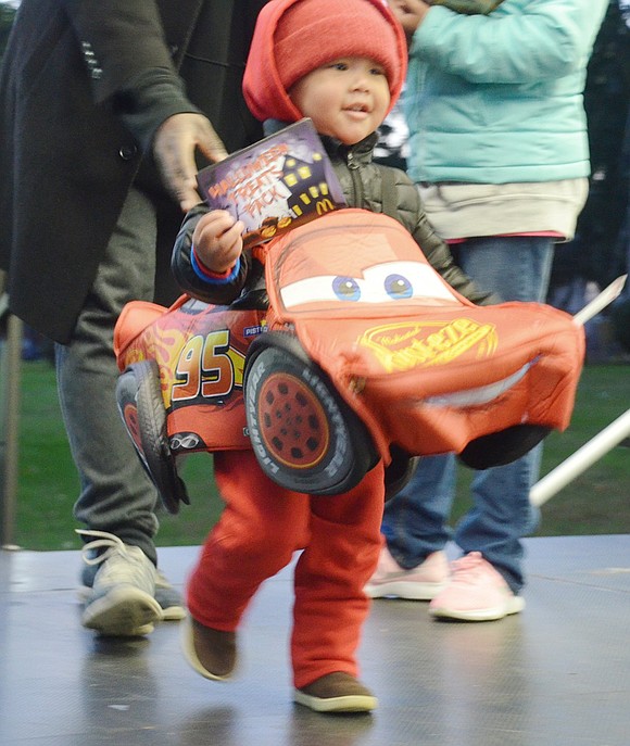 Terrace Avenue resident Levi Elder, 2, is so excited to show off his speeding abilities as Lightning McQueen on the stage, he almost zooms right past his award after being acknowledged in the contest.