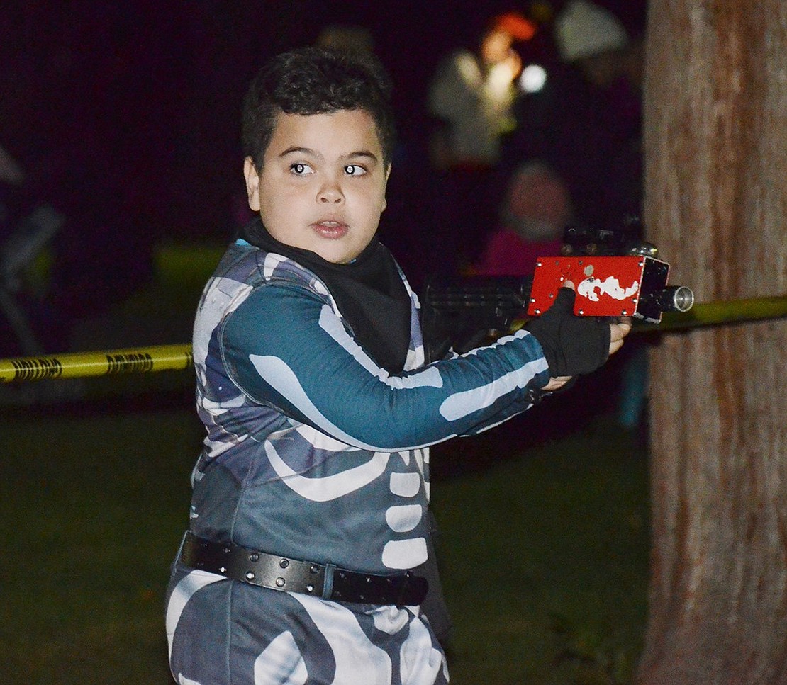 Would you be able to survive the zombie apocalypse? Thomas Edison Elementary School fourth-grader Joaquin Silveira shows he’s prepared during zombie laser tag.