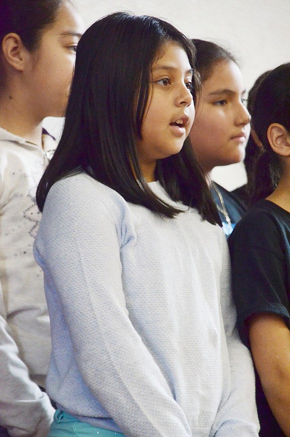 The Park Avenue School ceremony was facilitated by the entire fifth-grade class for their service learning project to help the community. To honor veterans, Briseyda Lucas sings “My Country ’Tis of Thee” with the rest of Veronica Sanguino’s fifth-grade class.