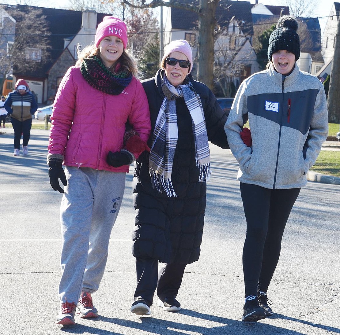 Terry Heller, 82, of Port Chester, walks the course with her granddaughters Julie (left) and Megan Tiedemann of Rye. Their father Art is a science teacher at Port Chester Middle School.