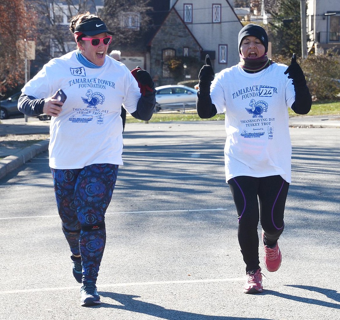 Kristi Greenberg of the Bronx and Natalia Chavez of New Rochelle are ecstatic about nearing the finish line.