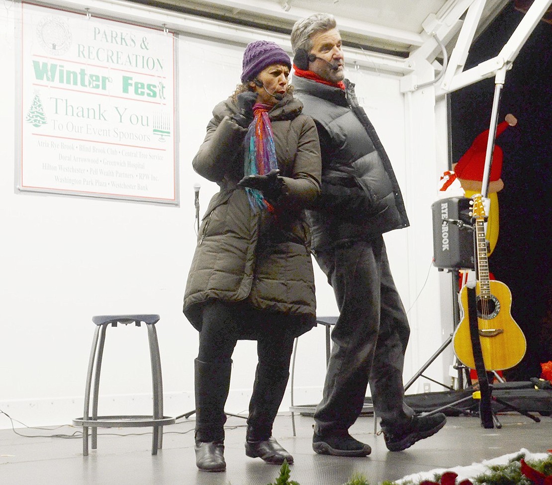 After joking about whether it’s possible to get frostbite while playing the guitar, children’s music performers Beth and Scott Bierko bring some heat to the stage with a song and dance about the seven principles of Kwanzaa.