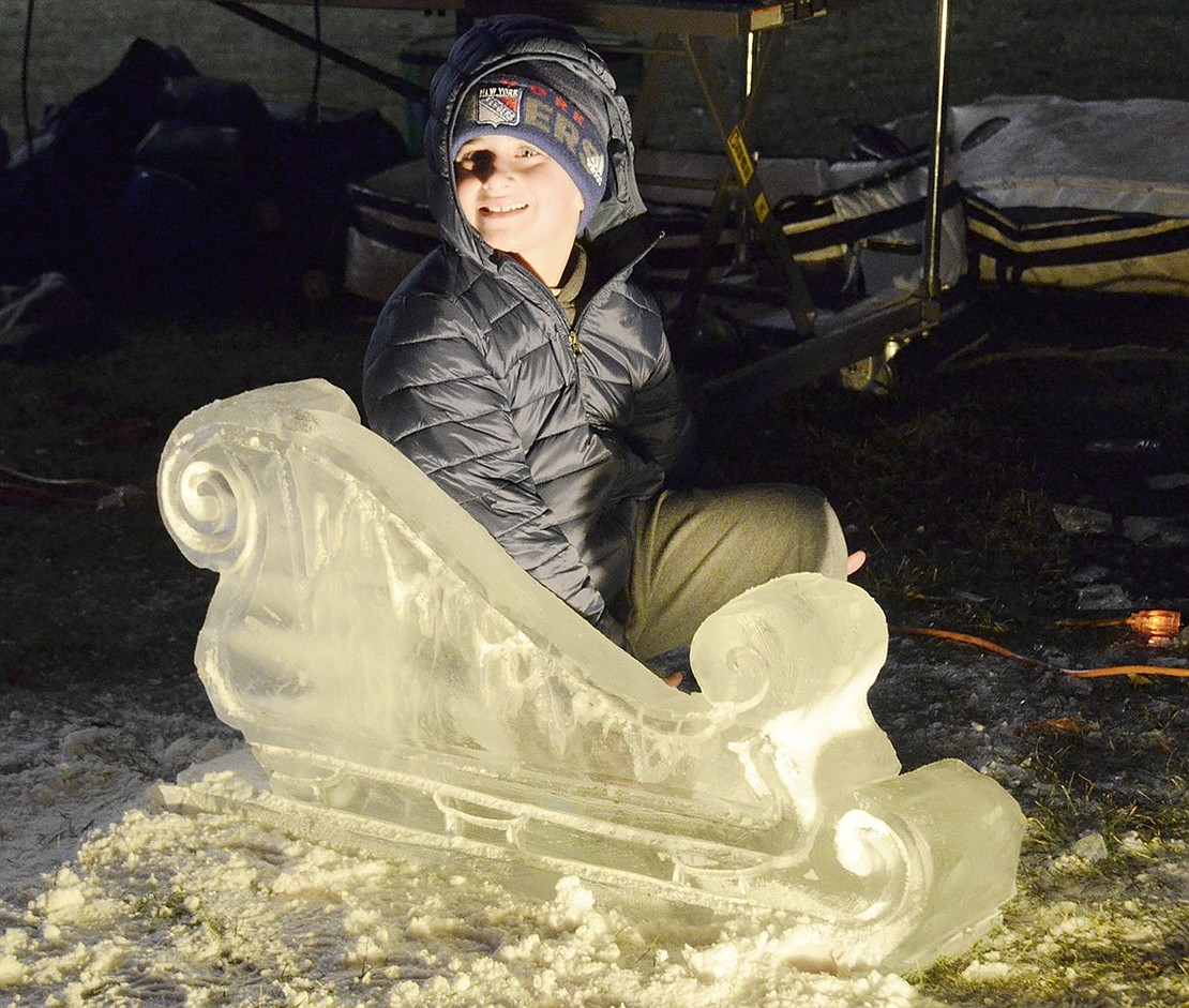 Old Orchard Road resident Alec Glantz is ready for a frosty ride. The Ridge Street Elementary School third-grader pretends to ride an ice sculpted sleigh as he poses for a picture for his mother.