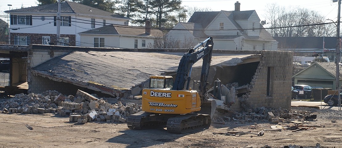 On Monday, Dec. 10, excavator caves in the roof of the original DPW building constructed in 1938.