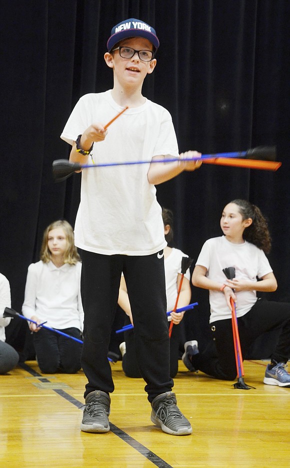 Jackson Scala makes the devil sticks look so easy as he smoothly tosses a baton back and forth between two rods.