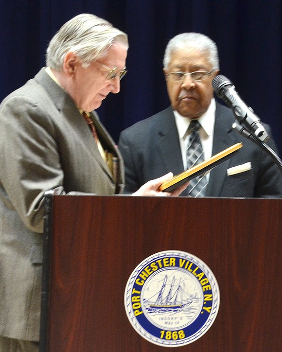 Port Chester resident Thomas Kissner accepts a Humanitarian Award from Rev. Daniel Hickman, pastor of Community Baptist Church in New Canaan, for his service to his country and community throughout his lifetime including being the first Caucasian to serve as president of the Port Chester-Rye NAACP.