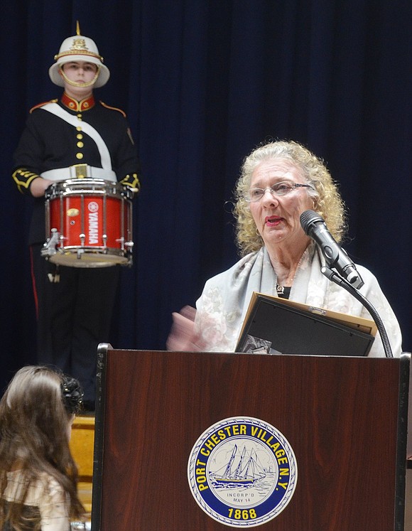 Freda Wesley speaks after accepting a Humanitarian Award on behalf of her husband Albert, a student advocate who died Nov. 26, 2018. The Port Chester High School Marching Band drumline performs behind her. The band was a passion of Wesley’s and he served as president of the PCHS Band Association when his son and daughter were in the musical group.