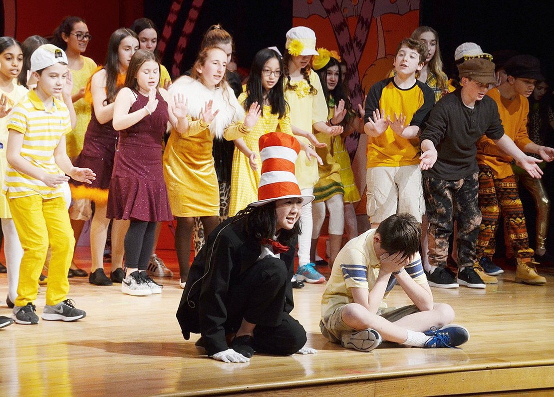 Jojo (played by Tyler Oppenheimer) hides his face when the Cat in the Hat (played by Lauren Sun) describes imagining something sinister and scary during “Oh, The Things You Can Think.”