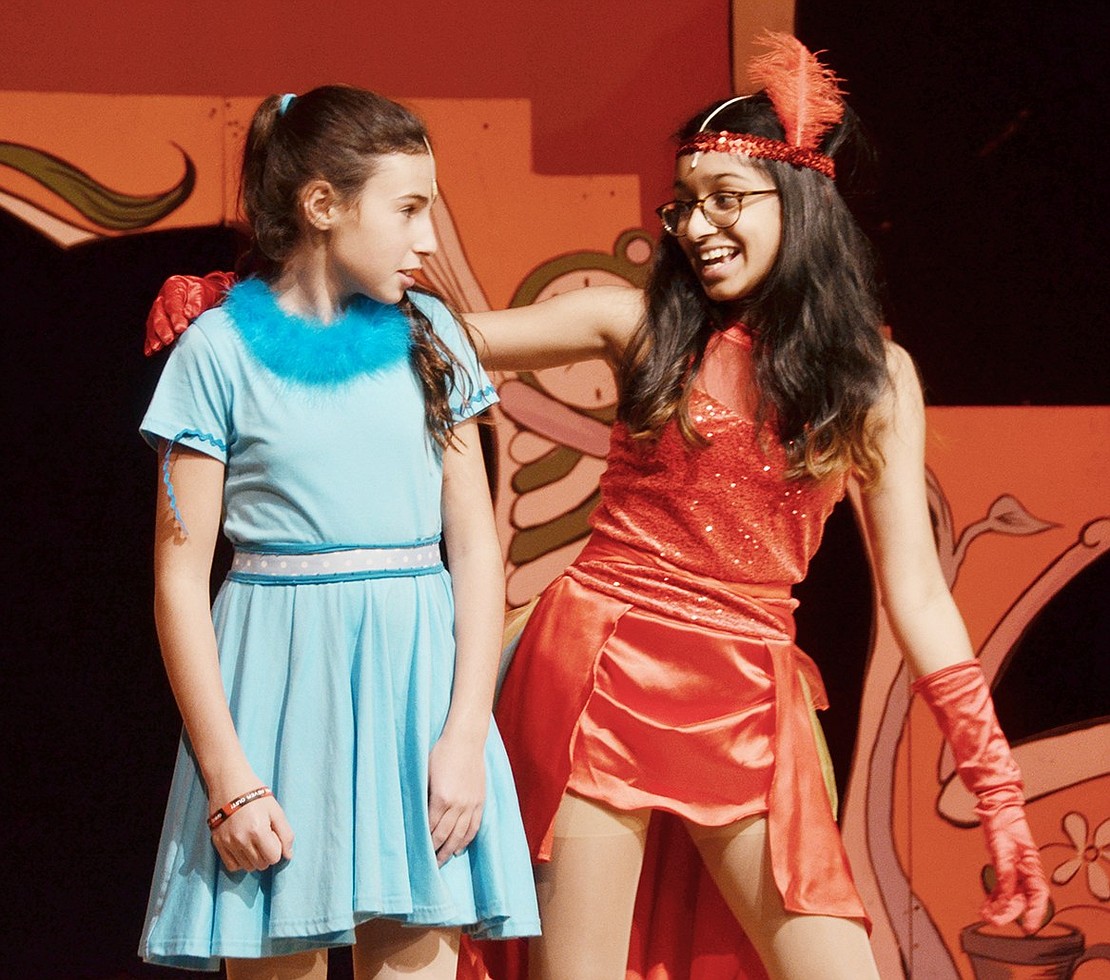 Mayzie La Bird (played by Rachel George) convinces her feathered friend Gertrude McFuzz (played by Cassidy Wohl) to take some magical pills to make her tail more extravagant.