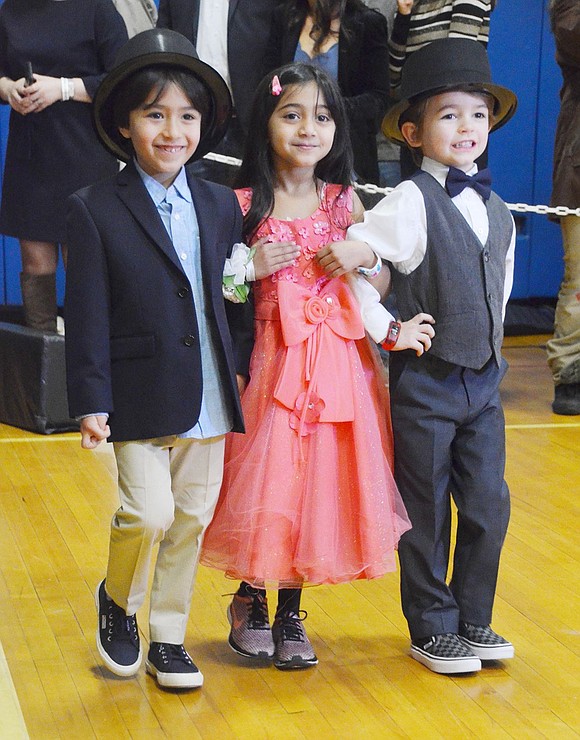 Pretty in pink Aria Desai has two dapper gentlemen to escort her around the gym: Cooper Fishkind (left) and Hayden Cullagh.