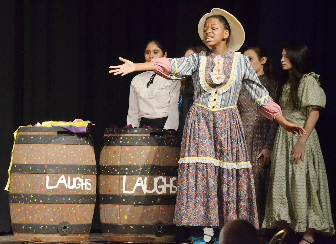 Mrs. Corry, played by Khabyrah Alston, sings in front of a few barrels of laughs about various ancient people who would surely have incorporated supercalifragilisticexpialidocious into their language.