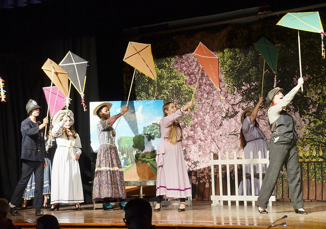 Props in hand, the “Mary Poppins” cast comes together to sing “Let’s Go Fly a Kite.”
