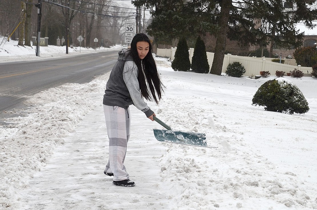 With a day off from school, Port Chester High School senior Kyah Kramer shovels the snow in front of her house at 648 King St. on Tuesday, Feb. 12. It was the first snowstorm of the season since the unexpected late afternoon blast in mid-November caught everyone off guard. Tuesday’s storm dropped a few inches of snow and freezing rain in Port Chester. Jananne Abel|Westmore News 