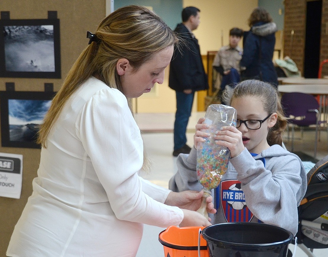 Stress is an important issue, so Student Assistance Counselor Monique Tricarico helps students make their own stress balls out of water beads and balloons. Ridge Street fourth-grader Samara Weinfeld is amazed by the bead’s smooth, oily texture.