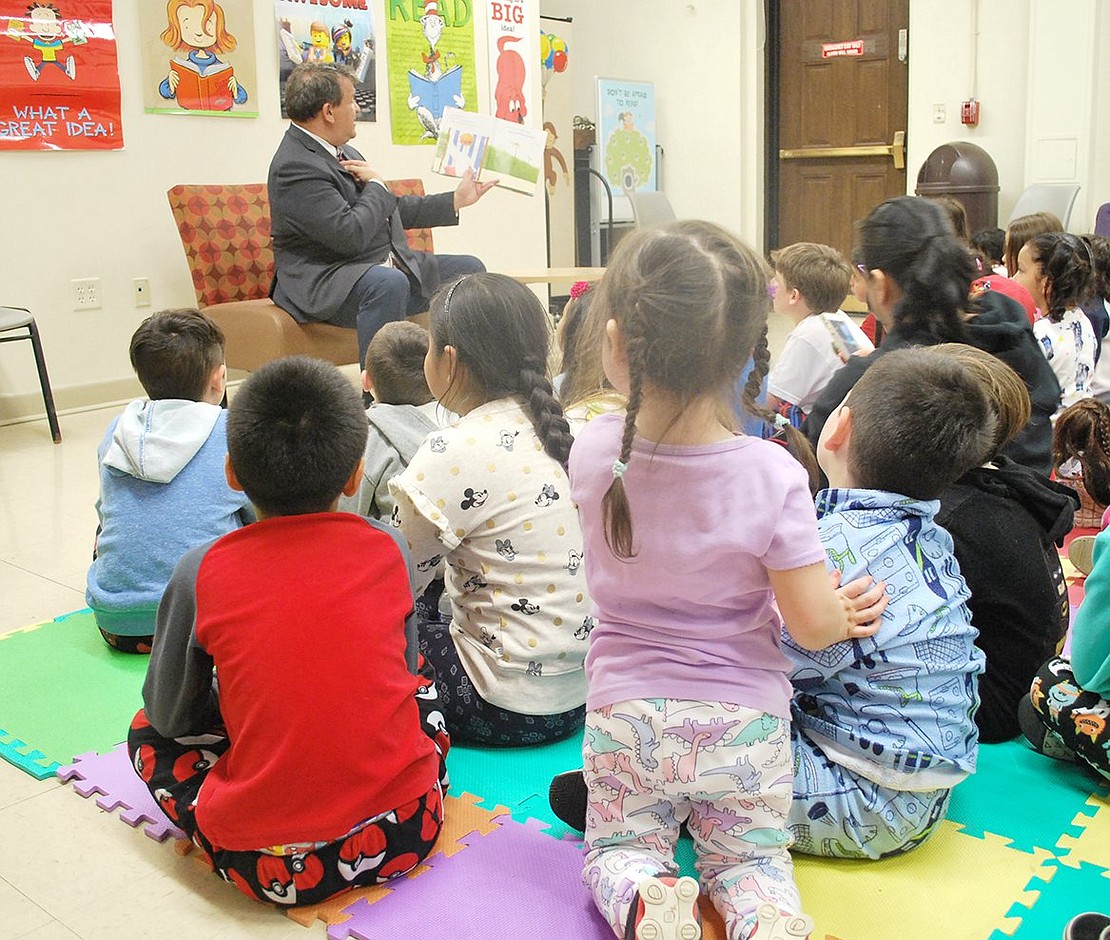 Roughly 60 comfy-looking kids are enthralled by County Executive George Latimer’s colorful narration of the children’s book “Don’t Turn the Page” by Rachelle Burk. The county executive was one of several volunteers reading to kids at the Port Chester-Rye Brook Public Library on Tuesday, Apr. 30, during the annual Pajama Read Aloud to encourage the love of books through a comfortable environment.