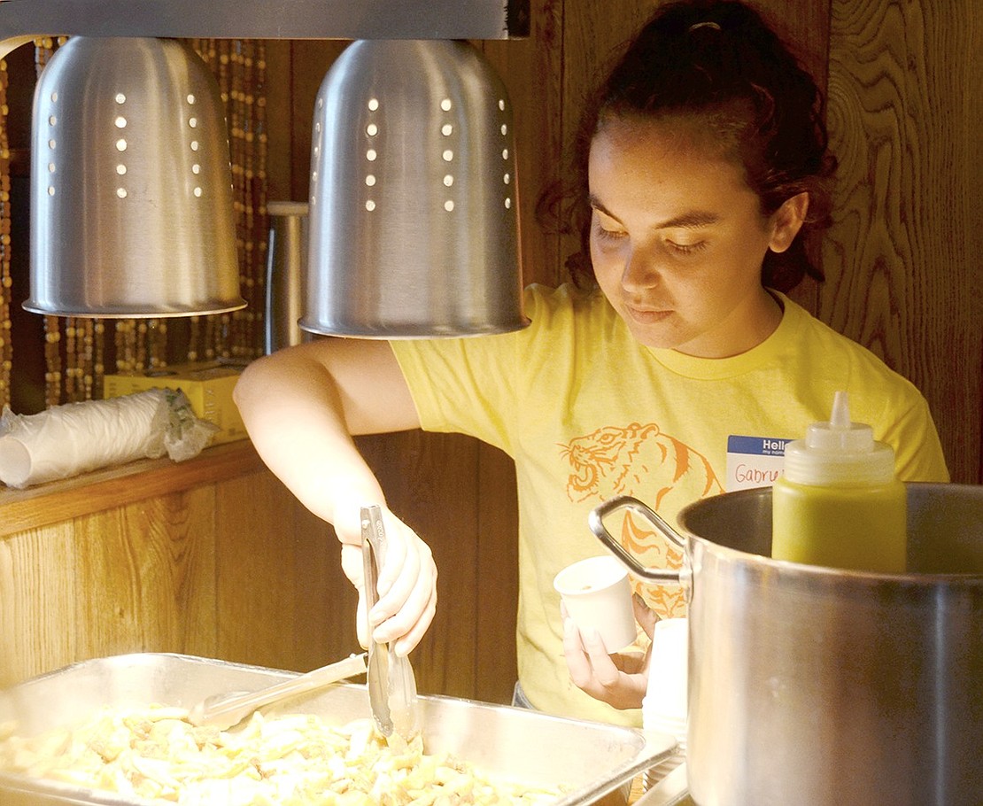 At Eugene’s Diner & Bar at 112 N. Main St., Gabriella Kessler’s face glows from the heat lamp as she scoops some fries into a sample cup for restaurant tourers. The Port Chester High School junior is one of 25 students who volunteered at participating restaurants across the village.