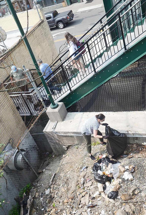 Jennifer Baez and Bridgette Vassil tackled this particularly trash-strewn area visible from the train and from the stairway leading from the tracks down to Westchester Avenue. The two women moved from New York City and bought a house on Park Avenue eight months ago. Commuting to the City every day, Jennifer said “it drives me bananas. It’s not that hard to pick up your garbage.” When they saw the Clean-up Day advertised on Facebook, they jumped at the chance to lend a hand.