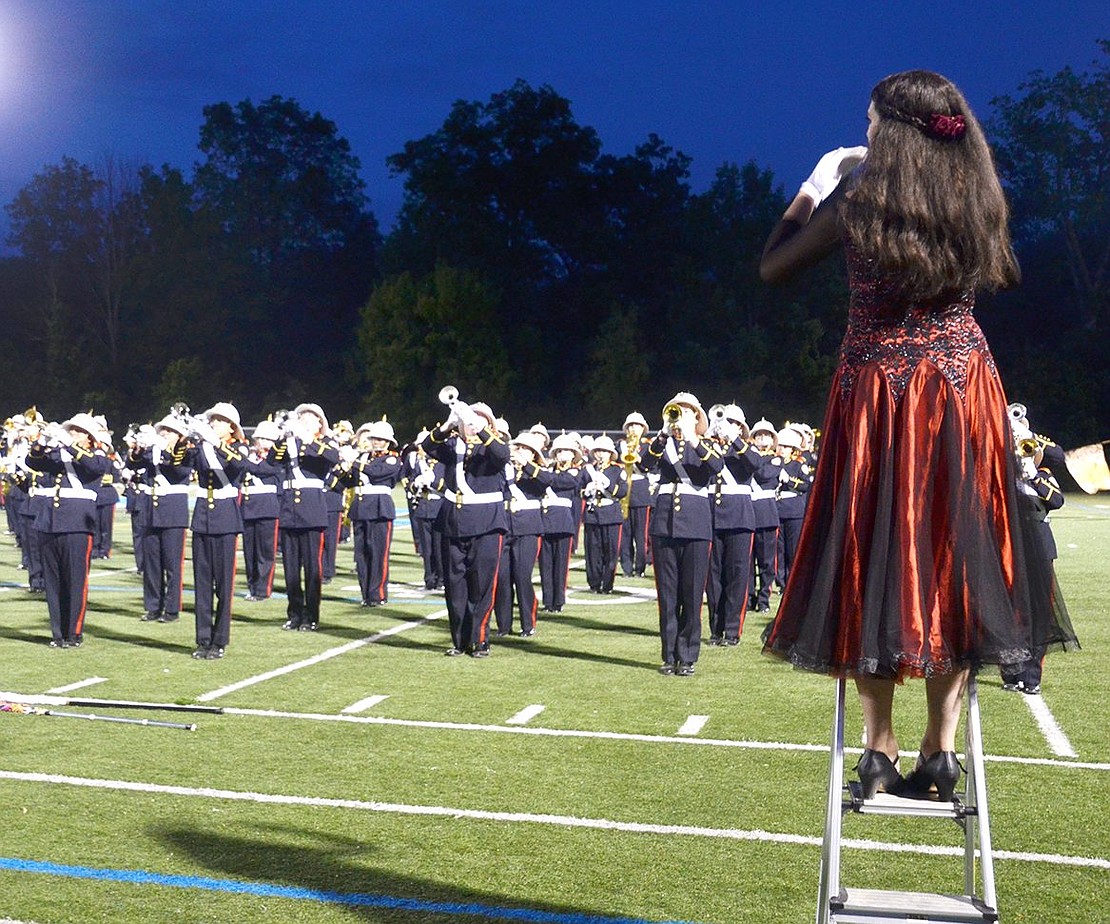 Port Chester High School senior drum major Savannah Langenbach conducts as the Pride of Port Chester plays their final notes of the “Alma del Bailador” show for the last time. All Port Chester School District bands and cheer teams celebrated the end of the year during the annual Band Night showcase on Tuesday, June 4, which took place at Purchase College for the first time.