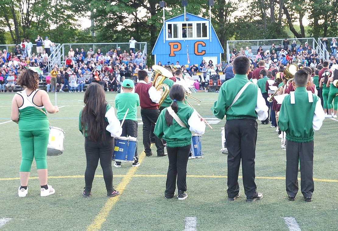 Edison School drummers face the audience and a press box painted with the letters PC. Though Band Night was moved from the Port Chester High School football field to Purchase College, there were still plenty of “PC” symbols to be enjoyed.