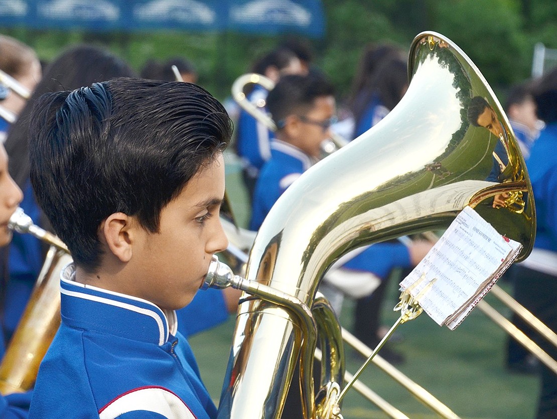 As sixth-grader Marcos Barajas plays “Come Go with Me,” his reflection in the baritone horn stares right back at him.