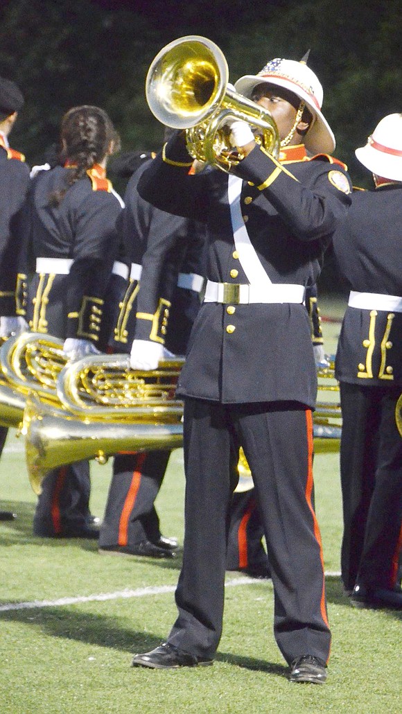 Centered on the field in the middle of the Pride of Port Chester show, Edzani Kelapile plays a solo on his baritone. Right after the performance, the high school junior was officially honored as the 2019-20 school year band vice president.