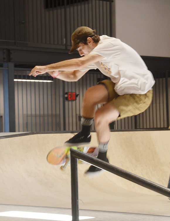 Glen Avenue resident Wyatt Zuk, 22, gets air as he does skateboarding tricks with several other experienced skaters on the more complex rink in the private park.