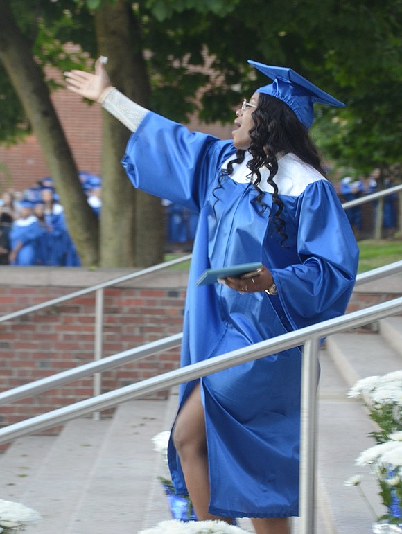 The proud and boisterous Trayonna Mood blows kisses to the audience after she accepts her diploma at the Port Chester High School Class of 2019 graduation ceremony on Thursday, June 27.