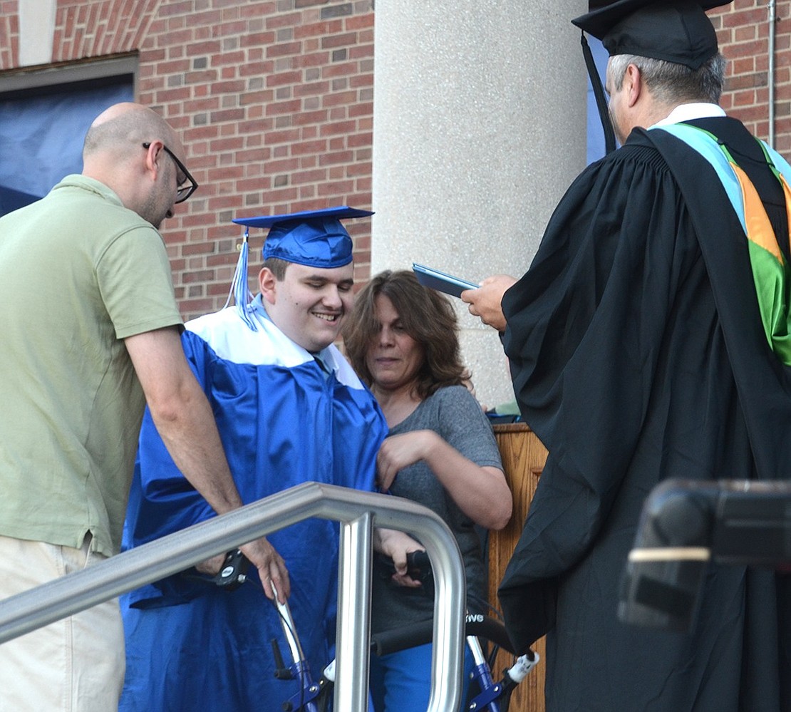 While every graduate’s name was met with cheers and whistles from the crowd, the loudest reaction from the entire Class of 2019 is for John Morello, who got out of his wheelchair to walk across the stage and accept his diploma from Board of Education member Lou Russo.