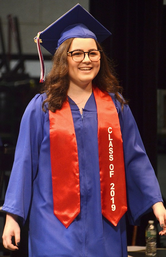 A massive grin springs across Adena Kibel’s face as she struts across the stage after her name is called.