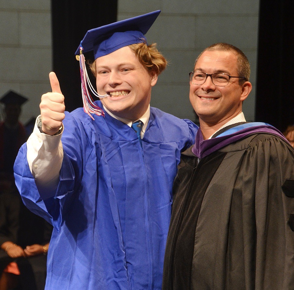 After finally receiving his diploma from Blind Brook Board of Education President Ryan Goldstein, Nathan  Crennan gives an enthusiastic thumbs up to a photographer during the Class of 2019 commencement ceremony on Tuesday, June 25. 