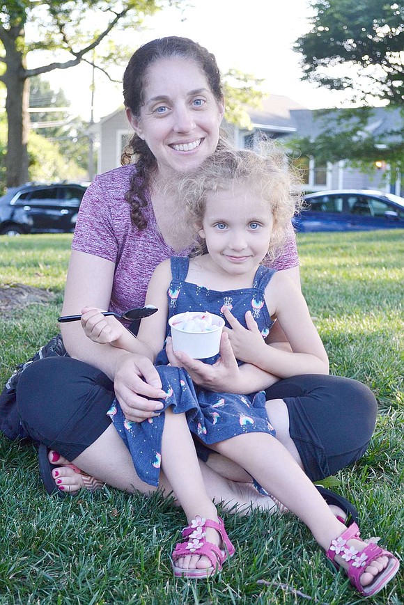 Rye Brook resident Hillary Seif visits Pine Ridge Park to cuddle and share ice cream with her 3-year-old daughter Maya.