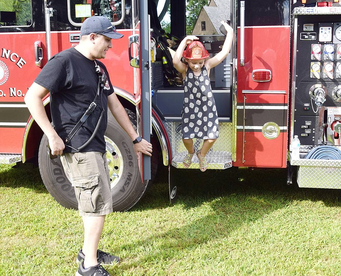 After Reliance Engine & Hose Company volunteer firefighter Chris Santucci lets Aria Rivera explore the fire truck, the King Street School rising first-grader takes a big jump to exit.